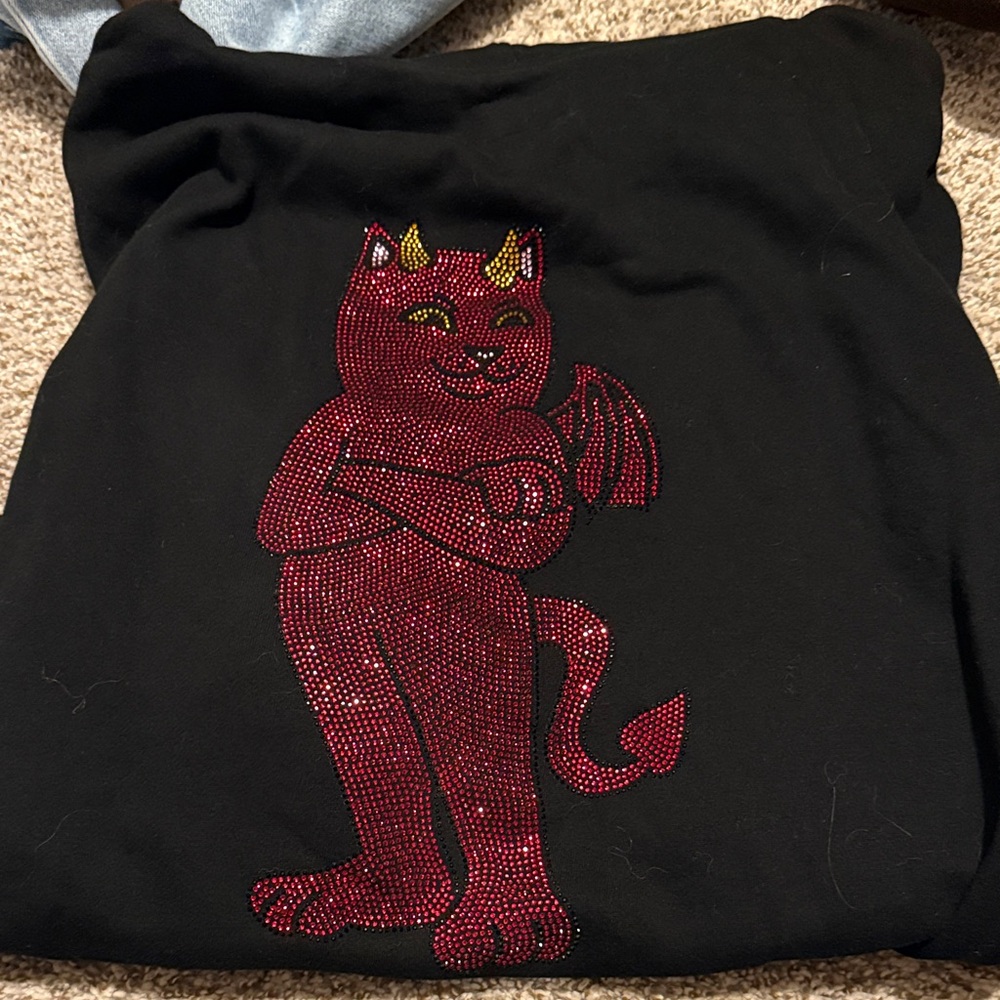 Ripndip hoodie yes it is little rinstones on front and back in Good condition